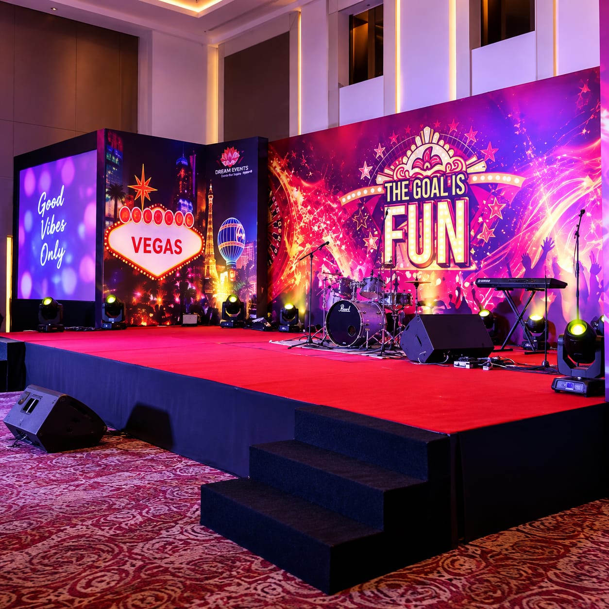 Corporate event stage with themed backdrop, lighting and live band setup